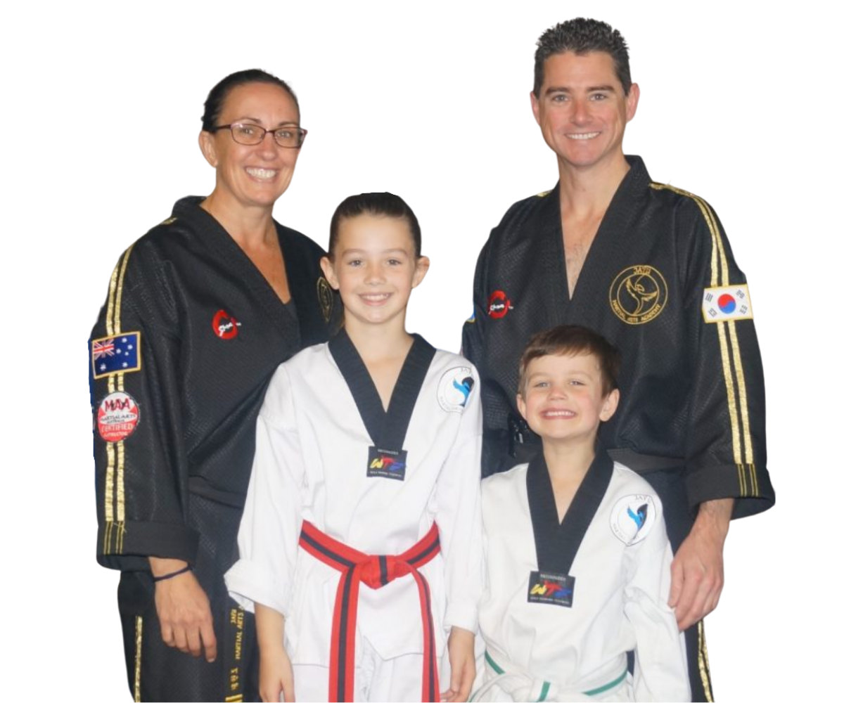woman and man smiling in black dobok standing behind girl and boy smiling in white dobok